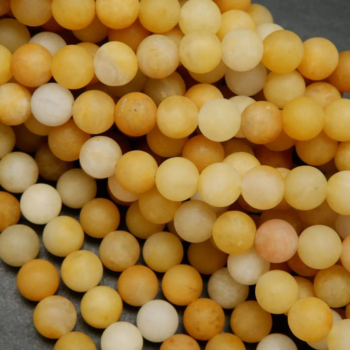 Matte finish yellow jade beads for jewelry making.
