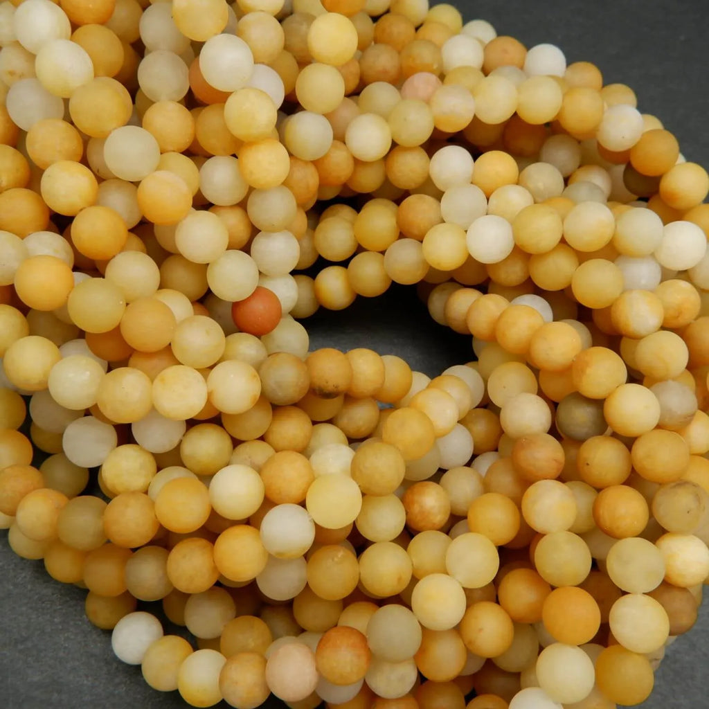 Matte finish yellow jade beads for jewelry making.
