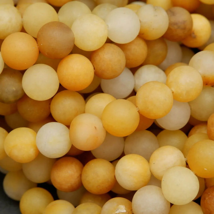 Matte finish yellow jade beads for jewelry making.