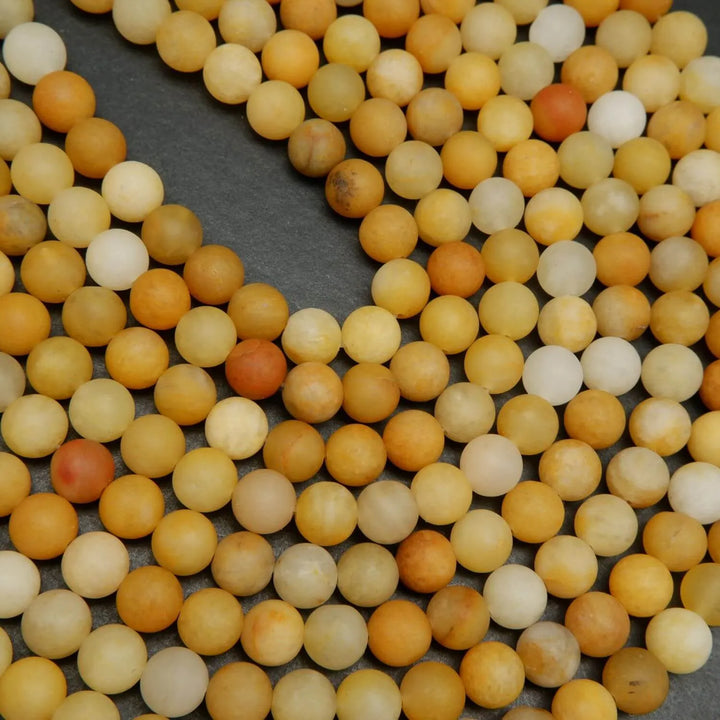 Matte finish yellow jade beads for jewelry making.