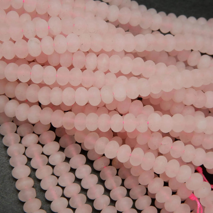 Pink matte finish rondelle rose quartz beads.