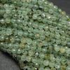 Prehnite with Epidote Inclusion Microfaceted Round Beads.
