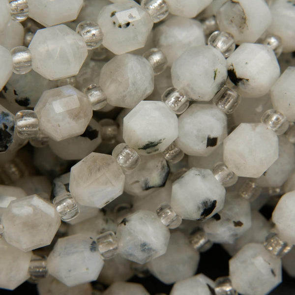 White tourmalated moonstone faceted prism shape beads.