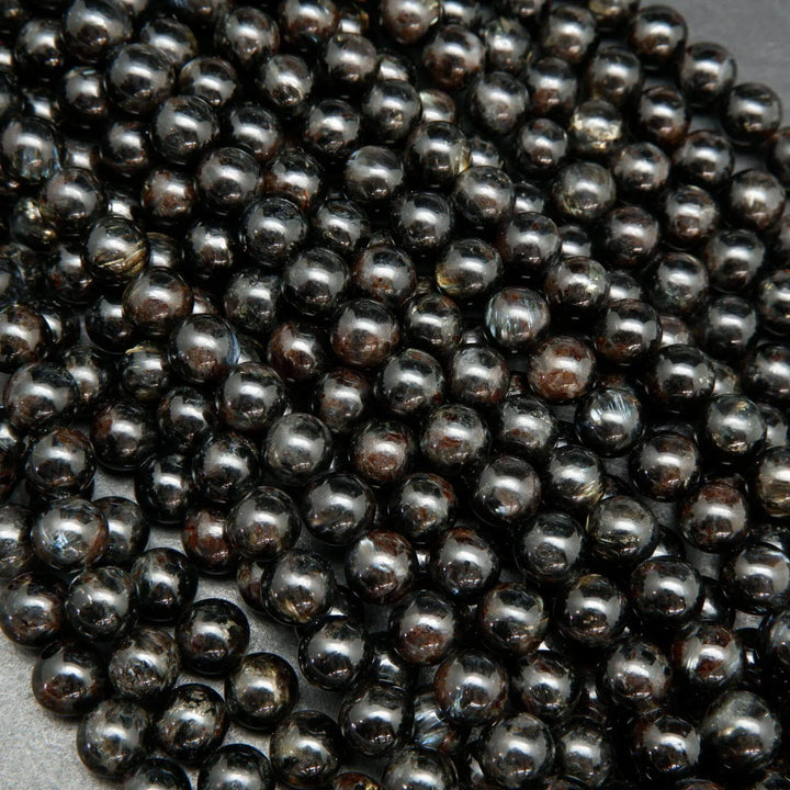 Black Arfvedsonite Beads with blue needles.