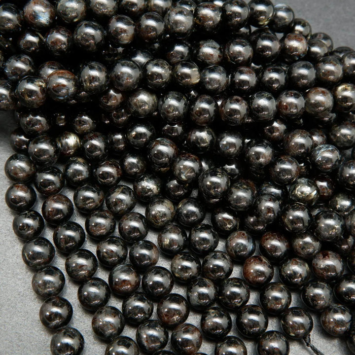 Black Arfvedsonite Beads with blue needles.
