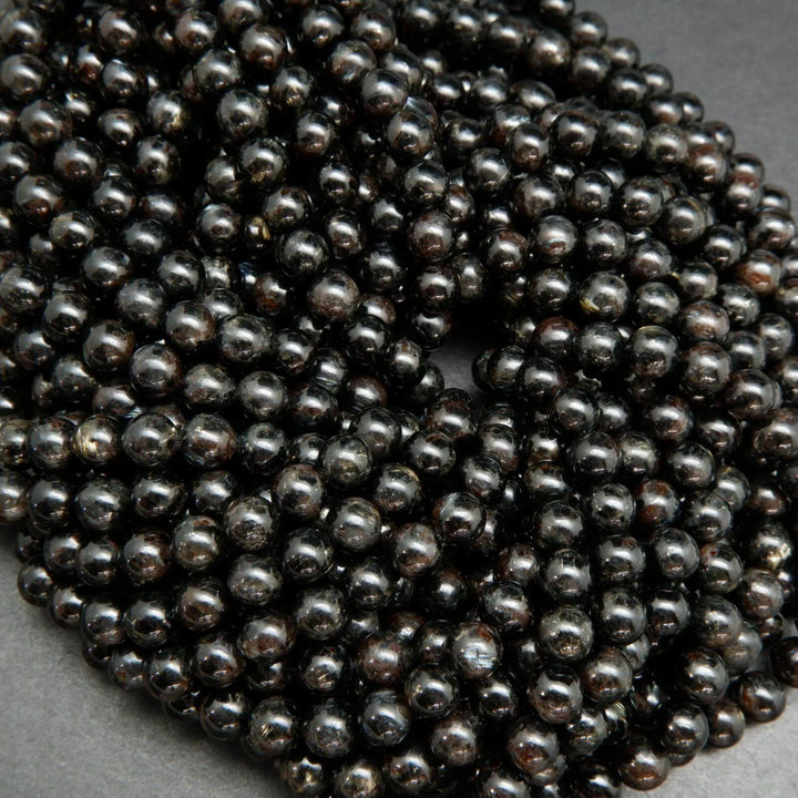 Black Arfvedsonite Beads with blue needles.