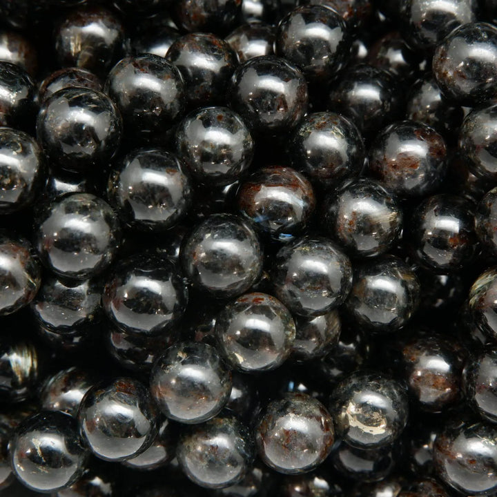 Black Arfvedsonite Beads with blue needles.