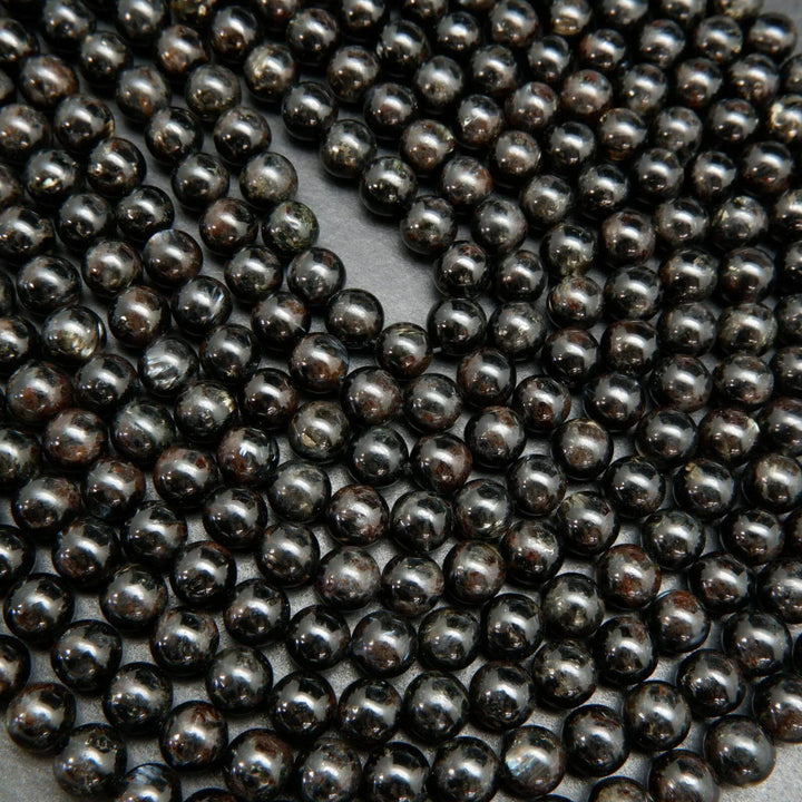 Black Arfvedsonite Beads with blue needles.