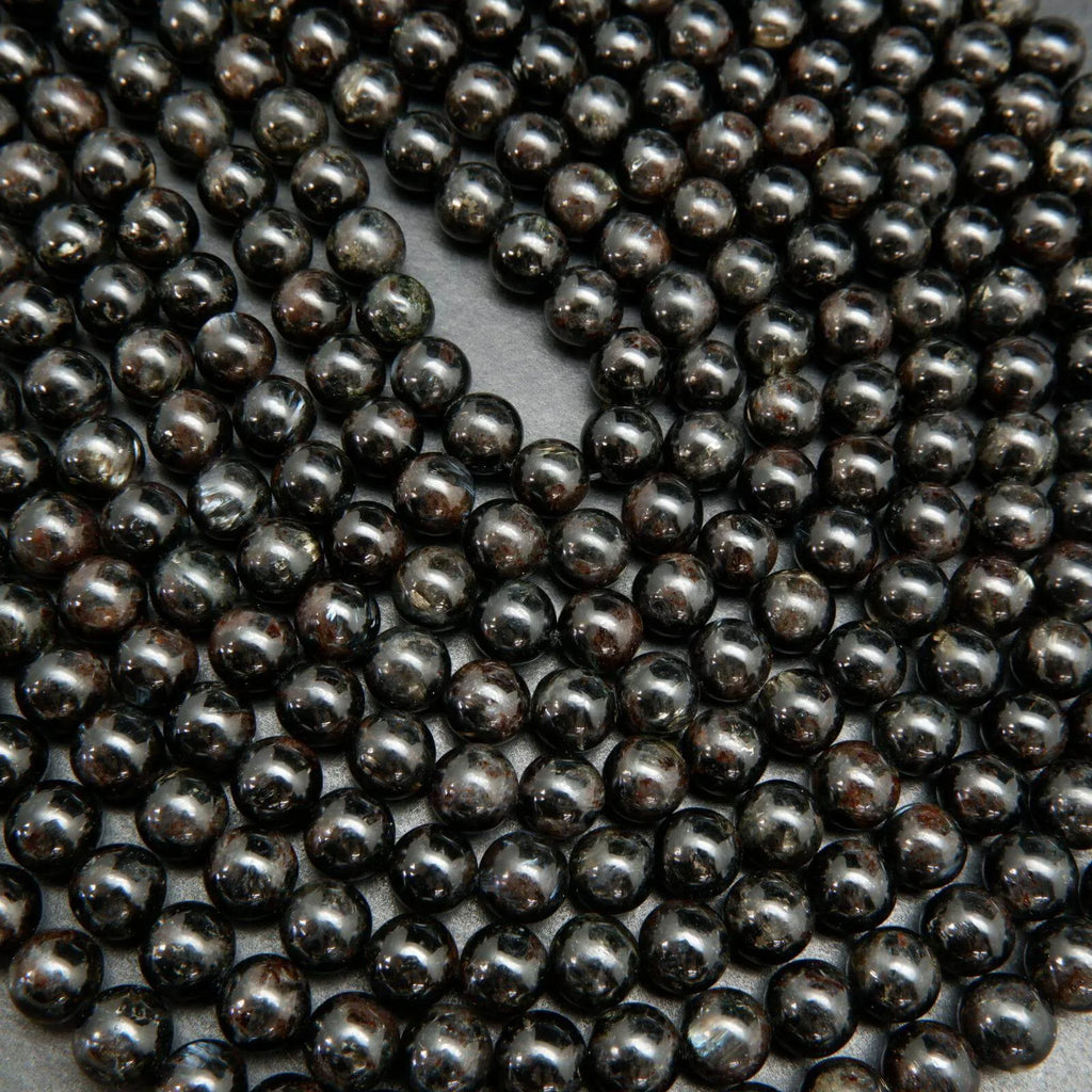 Black Arfvedsonite Beads with blue needles.