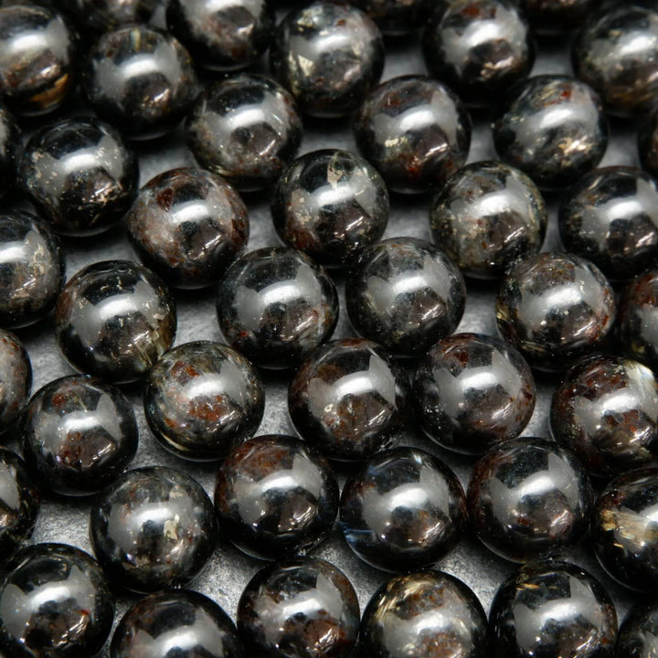Black Arfvedsonite Beads with blue needles.