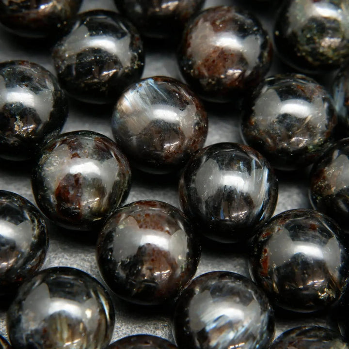 Black Arfvedsonite Beads with blue needles.