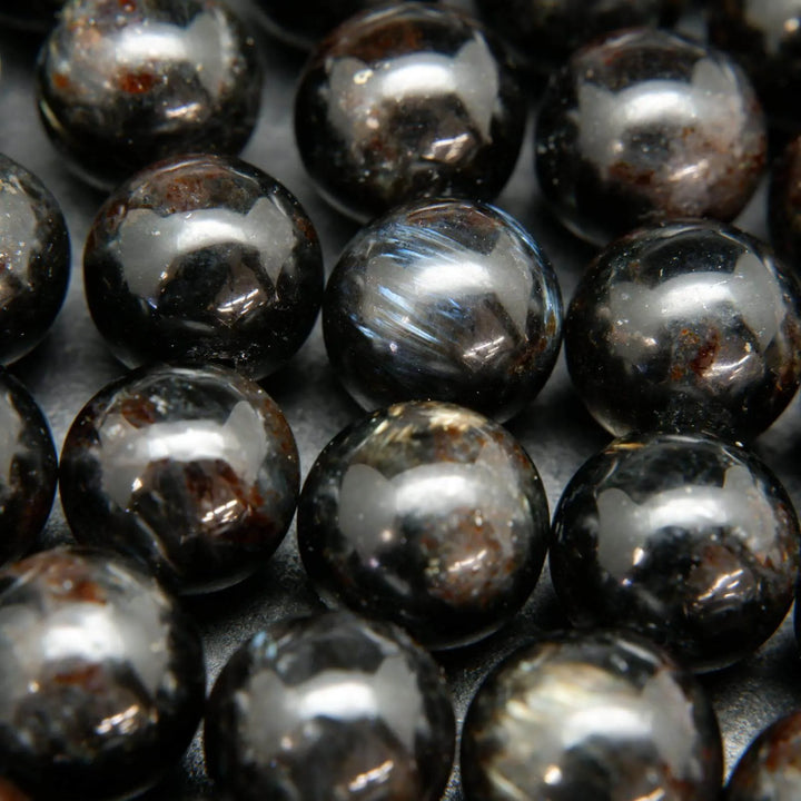 Black Arfvedsonite Beads with blue needles.