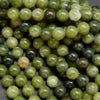 Green mixed hue jade beads. Round polished beads for making handmade jewelry. 