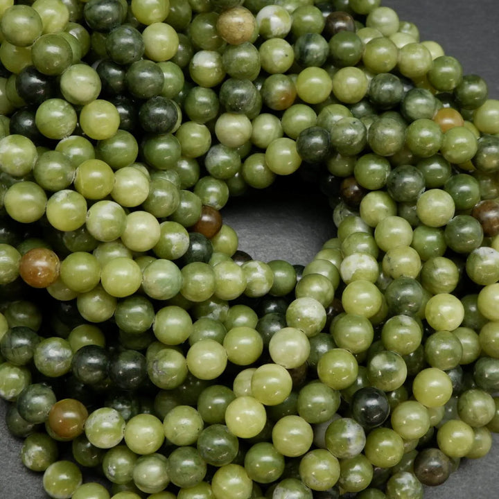 Green mixed hue jade beads. Round polished beads for making handmade jewelry. 
