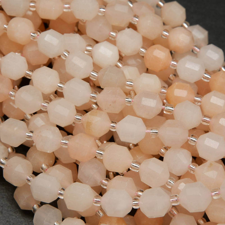 Peach aventurine faceted prism beads.