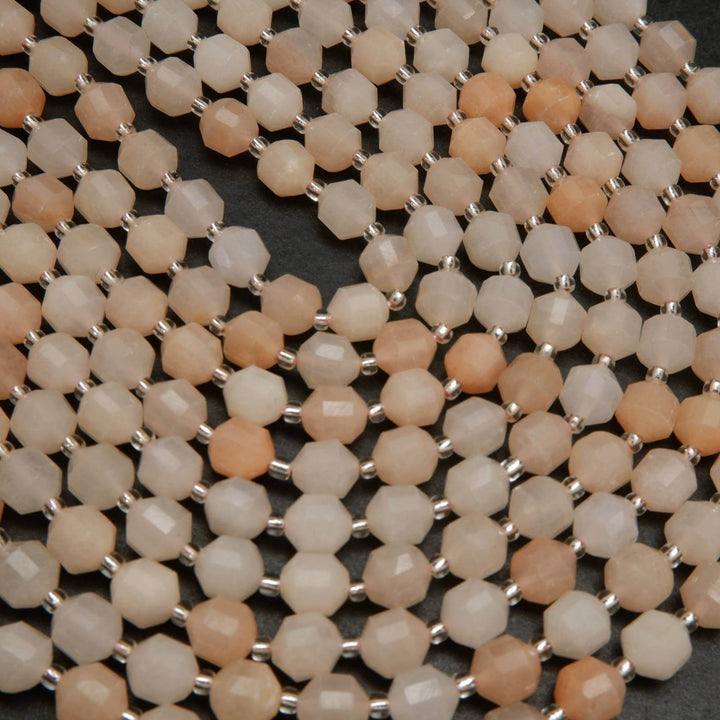 Peach aventurine faceted prism beads.