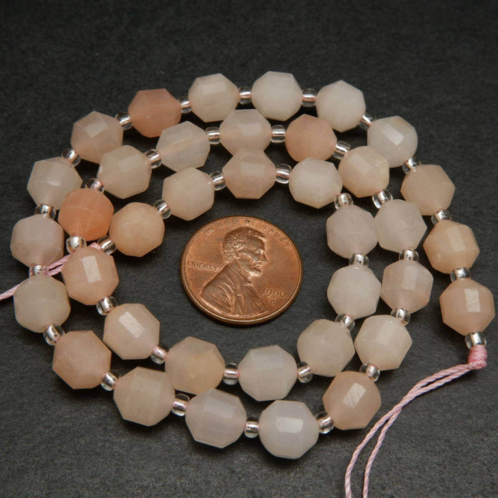 Peach aventurine faceted prism beads.