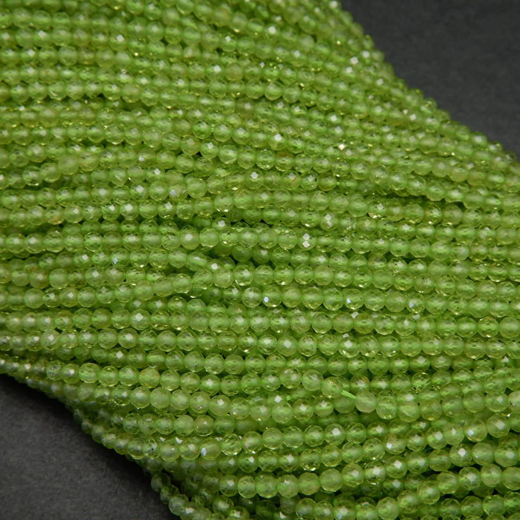 Green peridot microfaceted round beads.