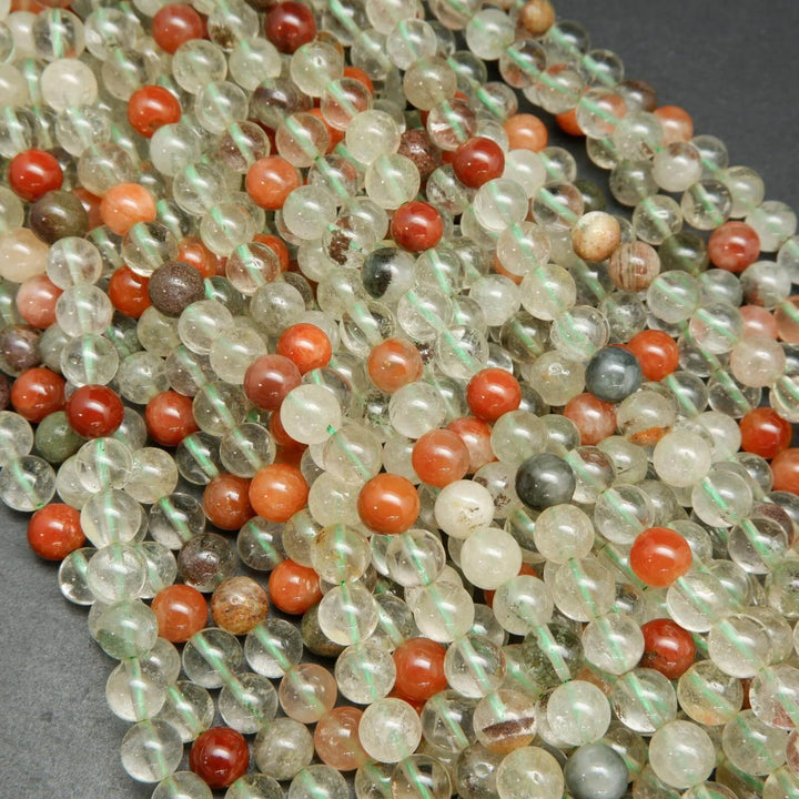 Clear and red phantom quartz beads.