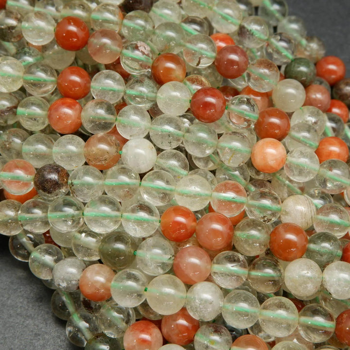 Clear and red phantom quartz beads.