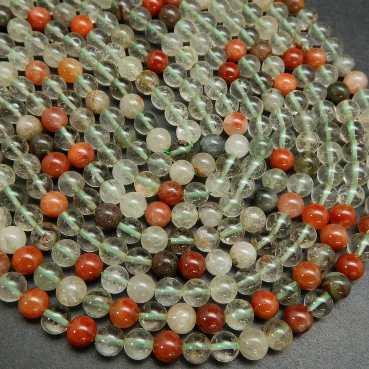 Clear and red phantom quartz beads.