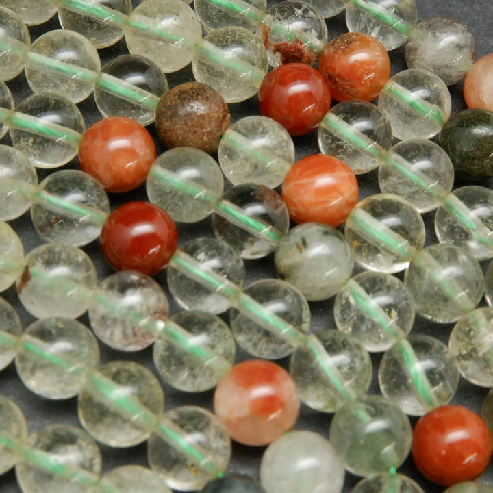 Clear and red phantom quartz beads.