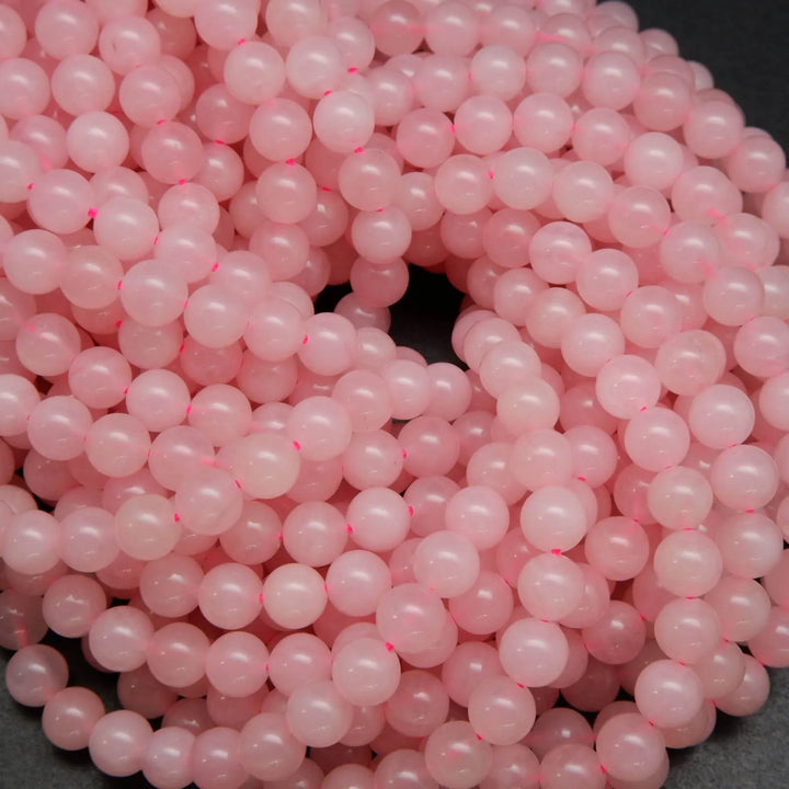Pink polished brazilian rose quartz beads.