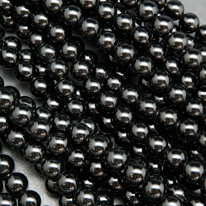 Polished Black obsidian beads.