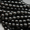Polished Black obsidian beads.