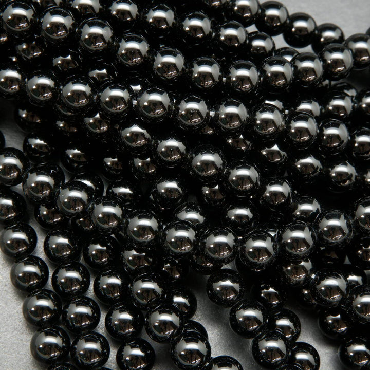 Polished Black obsidian beads.