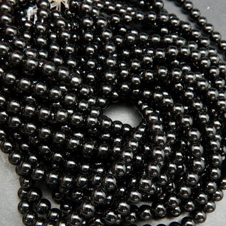 Polished Black obsidian beads.