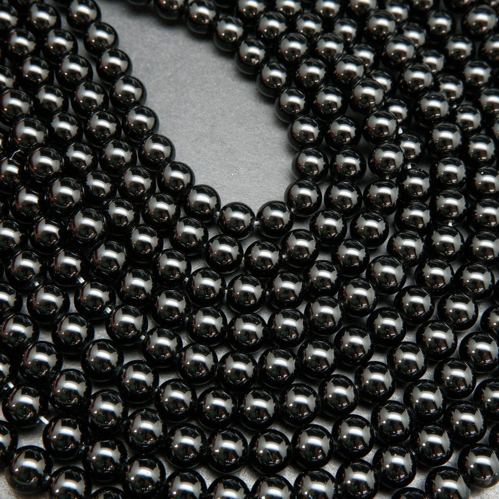 Polished Black obsidian beads.