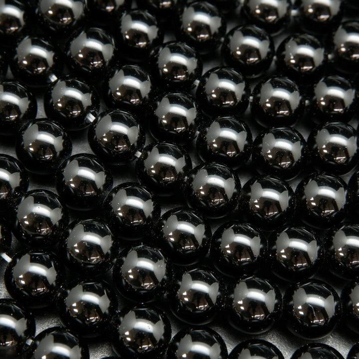 Polished Black obsidian beads.
