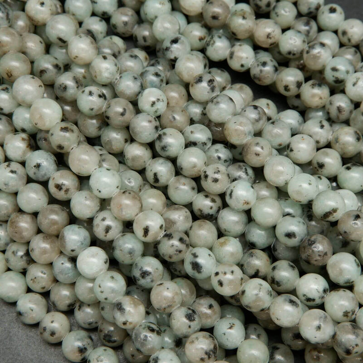 Minty green polished kiwi jasper beads.
