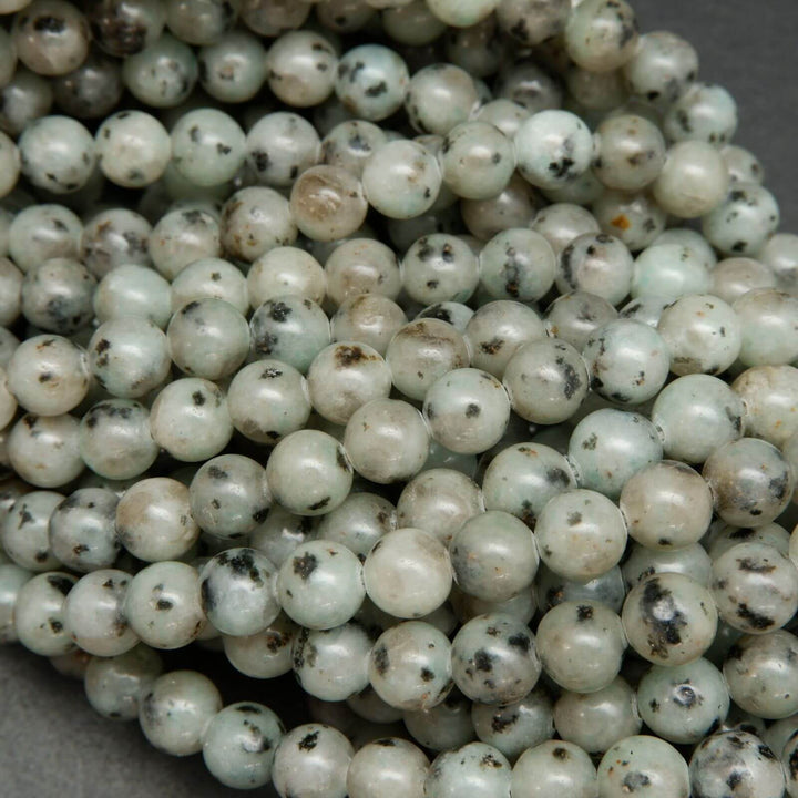 Minty green polished kiwi jasper beads.