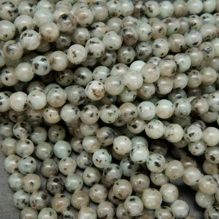 Minty green polished kiwi jasper beads.