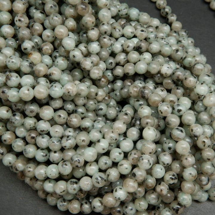Minty green polished kiwi jasper beads.