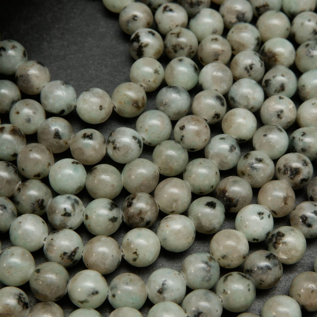 Minty green polished kiwi jasper beads.