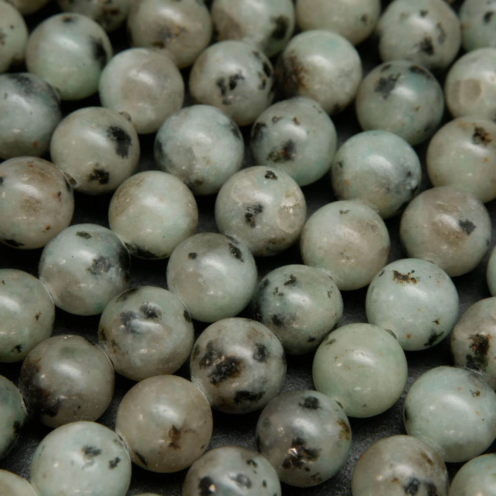 Minty green polished kiwi jasper beads.