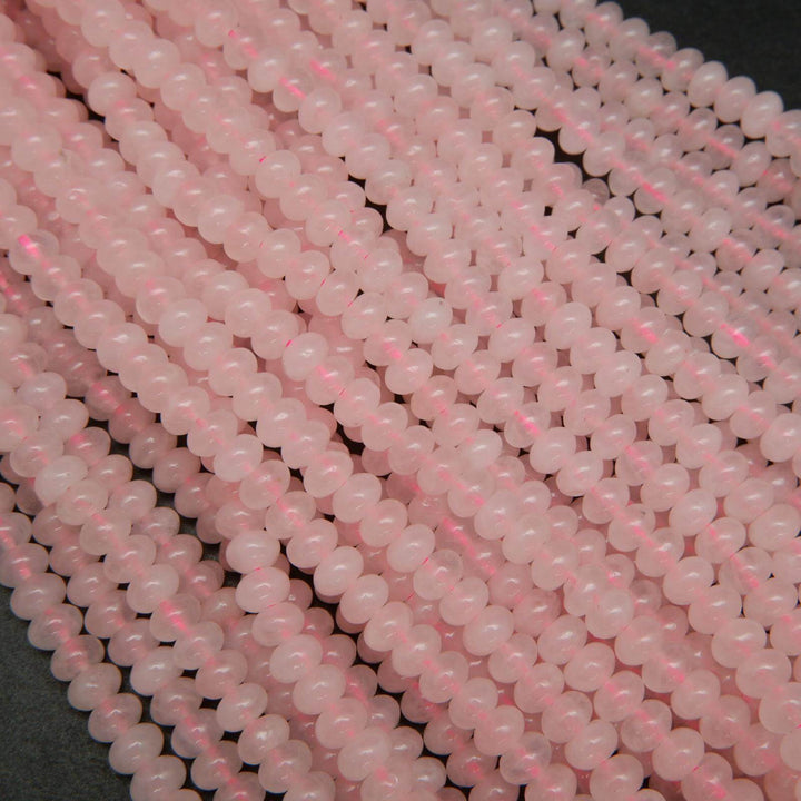 Pink polished rondelle rose quartz beads.