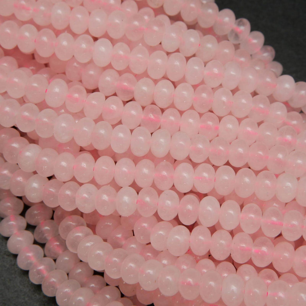 Pink polished rondelle rose quartz beads.
