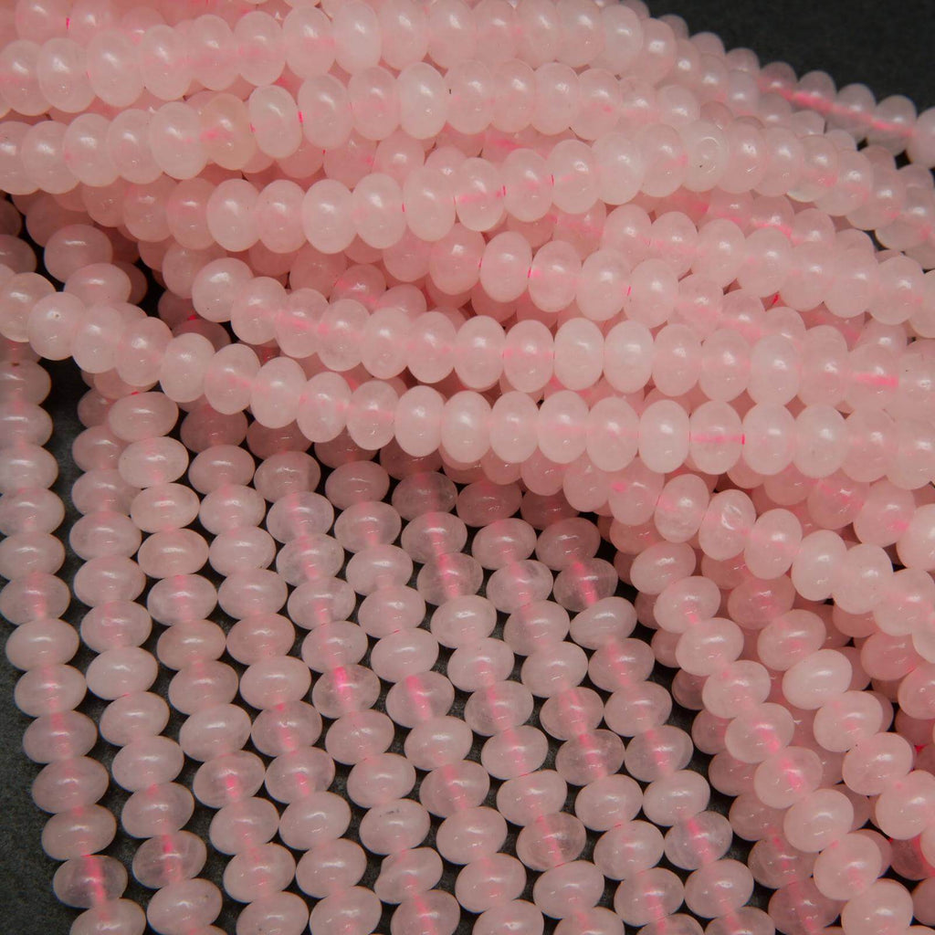 Pink polished rondelle rose quartz beads.