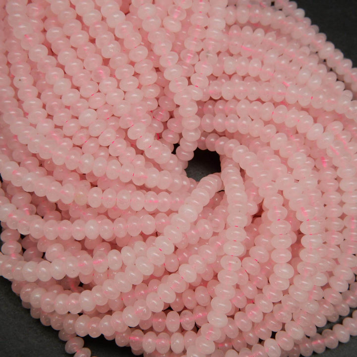 Pink polished rondelle rose quartz beads.