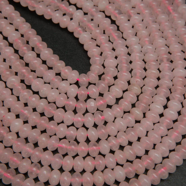 Pink polished rondelle rose quartz beads.