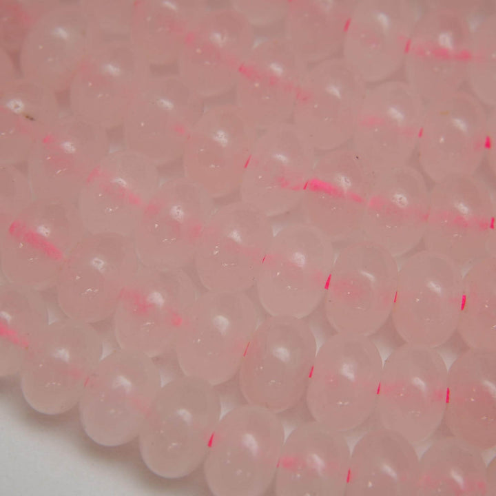 Pink polished rondelle rose quartz beads.