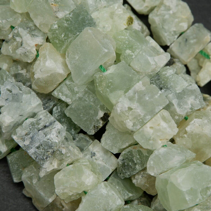 Green rough cut prehnite beads.