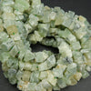 Green rough cut prehnite beads.