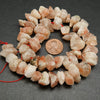 Raw cut sunstone beads.