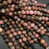 Large hole pink rhodonite with matrix beads.