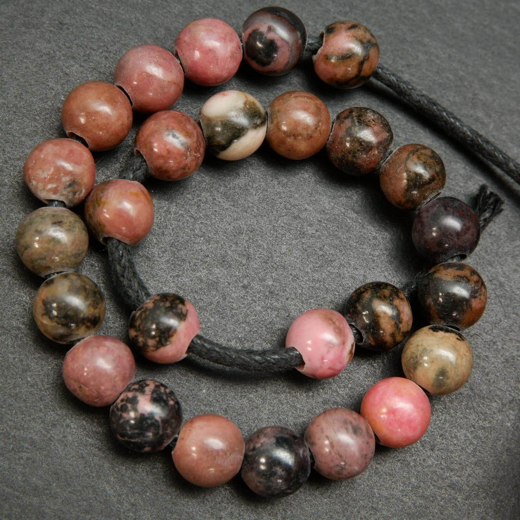 Large hole pink rhodonite with matrix beads.